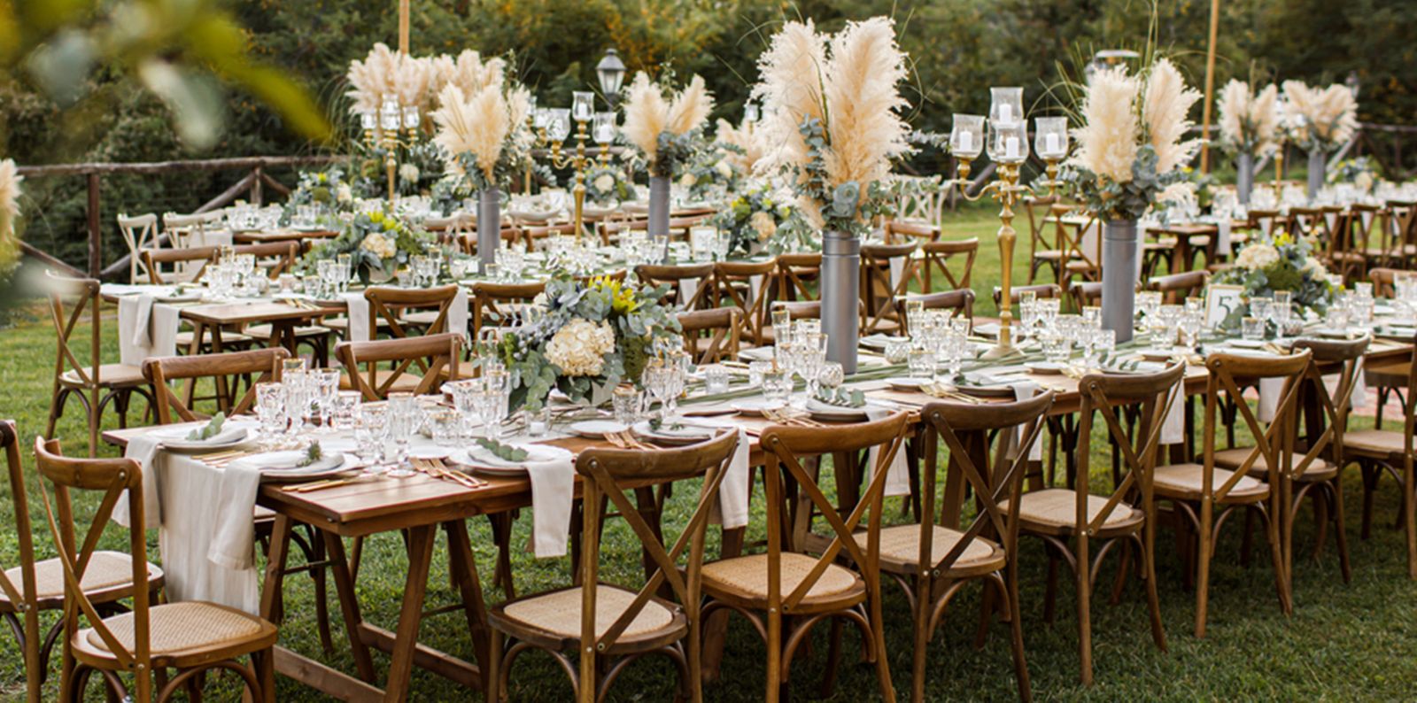 Cottagecore wedding table with lace, candles and wildflowers